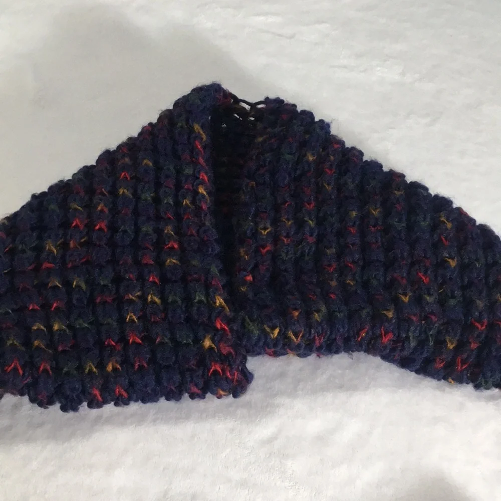 Blue knitted look infinity scarf with touches of red green gold